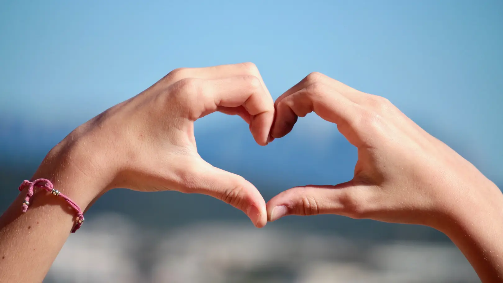 Hands making the shape of a heart