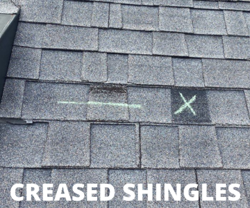 Creased asphalt shingles