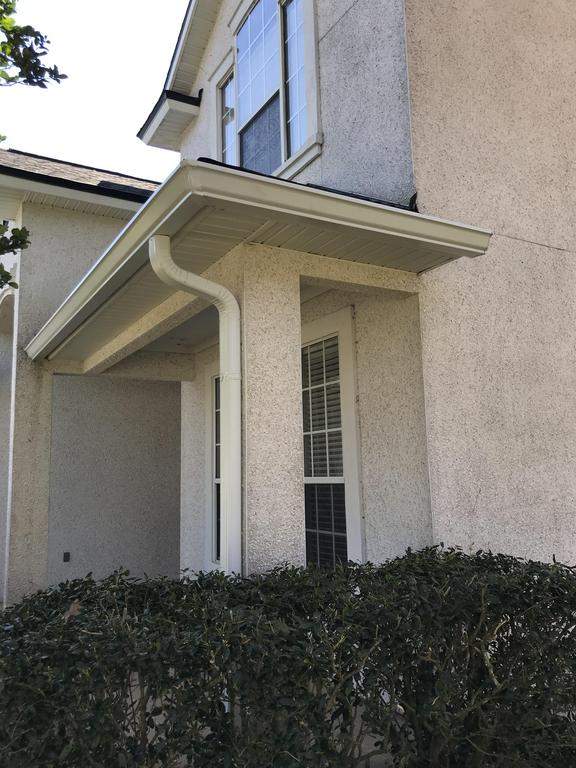 A two story home with new seamless gutters.