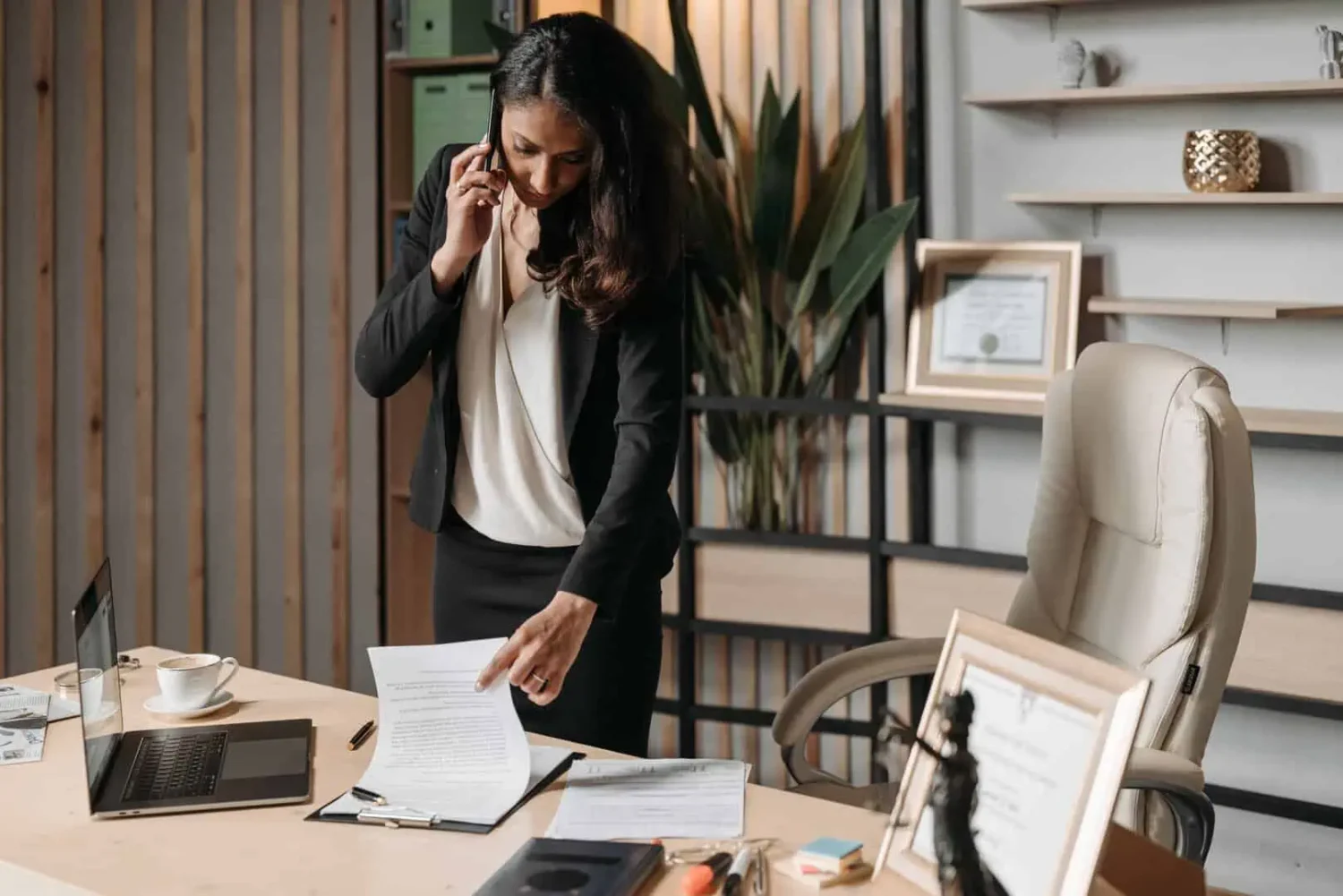 Women on the phone while looking at paperwork