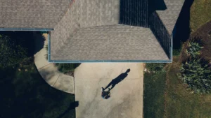 Top down view of a man standing in front of his home