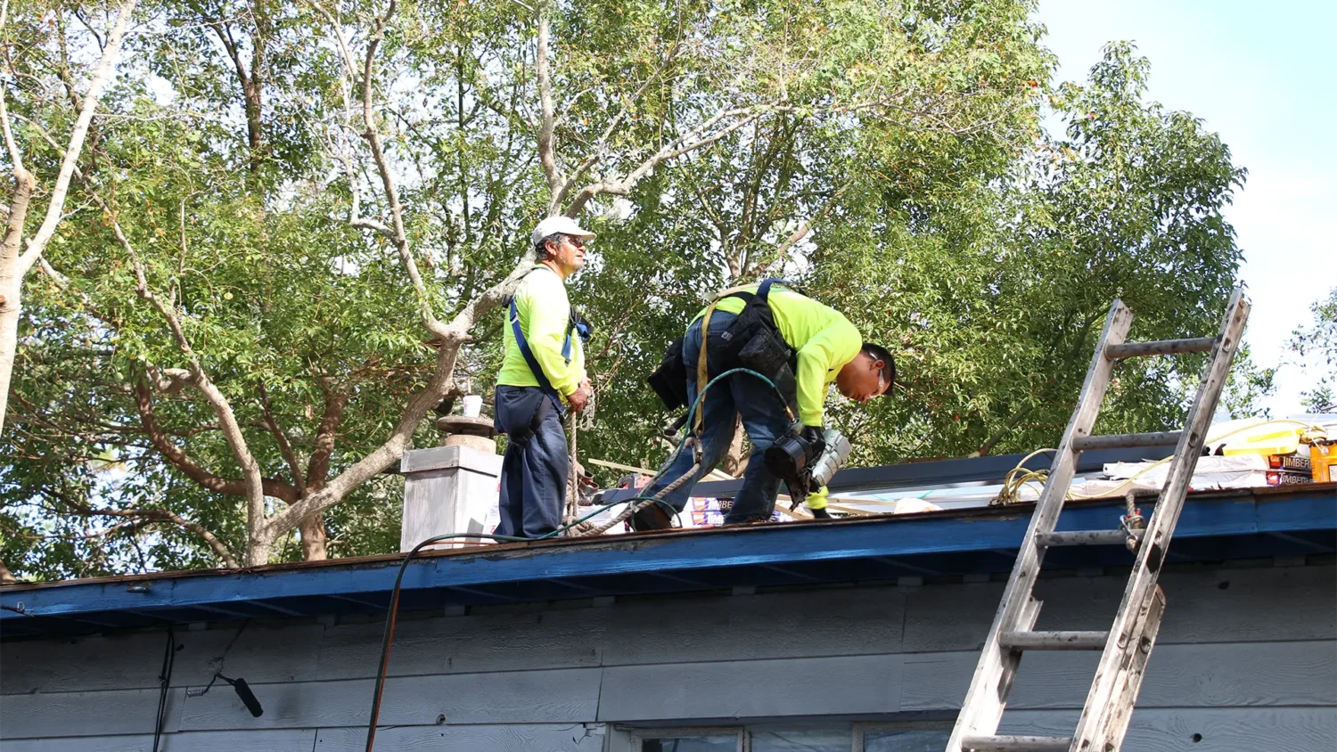 roofers repairing a roof